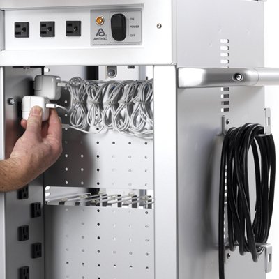 The cart's cable management system positions each power cord right at the front of the bay so you can quickly connect your device to power.  Clips route the cords from the front of each bay, along the bay divider and through a small opening to the back IT area where cords are bundled and the power adapter is plugged in