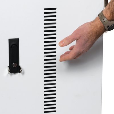 Doors, side panels, and inner divider are ventilated to keep air moving throughout the enclosure so devices stay cool. 