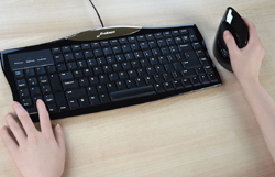 The left side navigation and numeric keys may be operated with your left hand to reduce reaching for them while using a right-hand mouse.