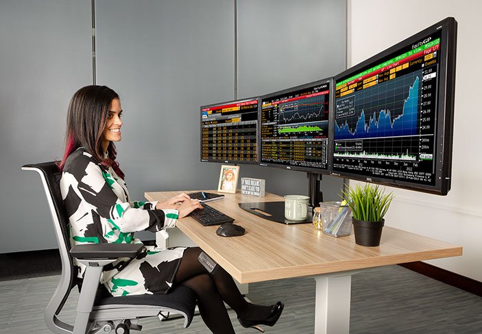 Ergotech Triple Monitor Horizontal Desk Stand in application