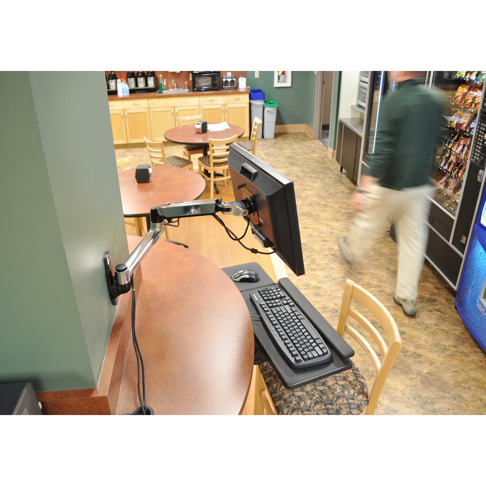 Ergotron 45-243-026 Wall Mount Monitor Arm in a cafeteria