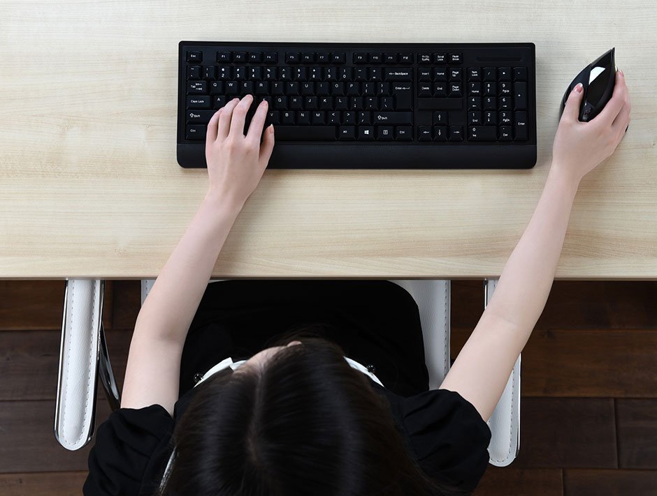 When the character keys are centered in front of you in a proper typing position, you have to stretch out your arm to reach the mouse.