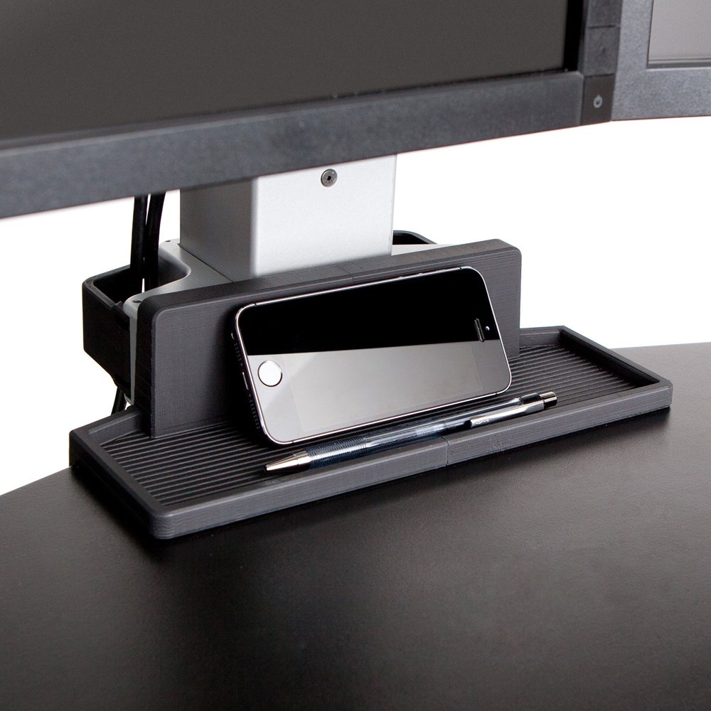 Expansive work surface features a storage tray - keeps items within reach
