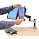 Ergotron 80-106-085 Universal Tablet Cradle is attached with a Dual Desk Arm that is shown beside a monitor