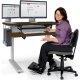 Joy in Customer Service moves her front worksurface lower and higher than the back worksurface for total comfort, sitting or standing.
